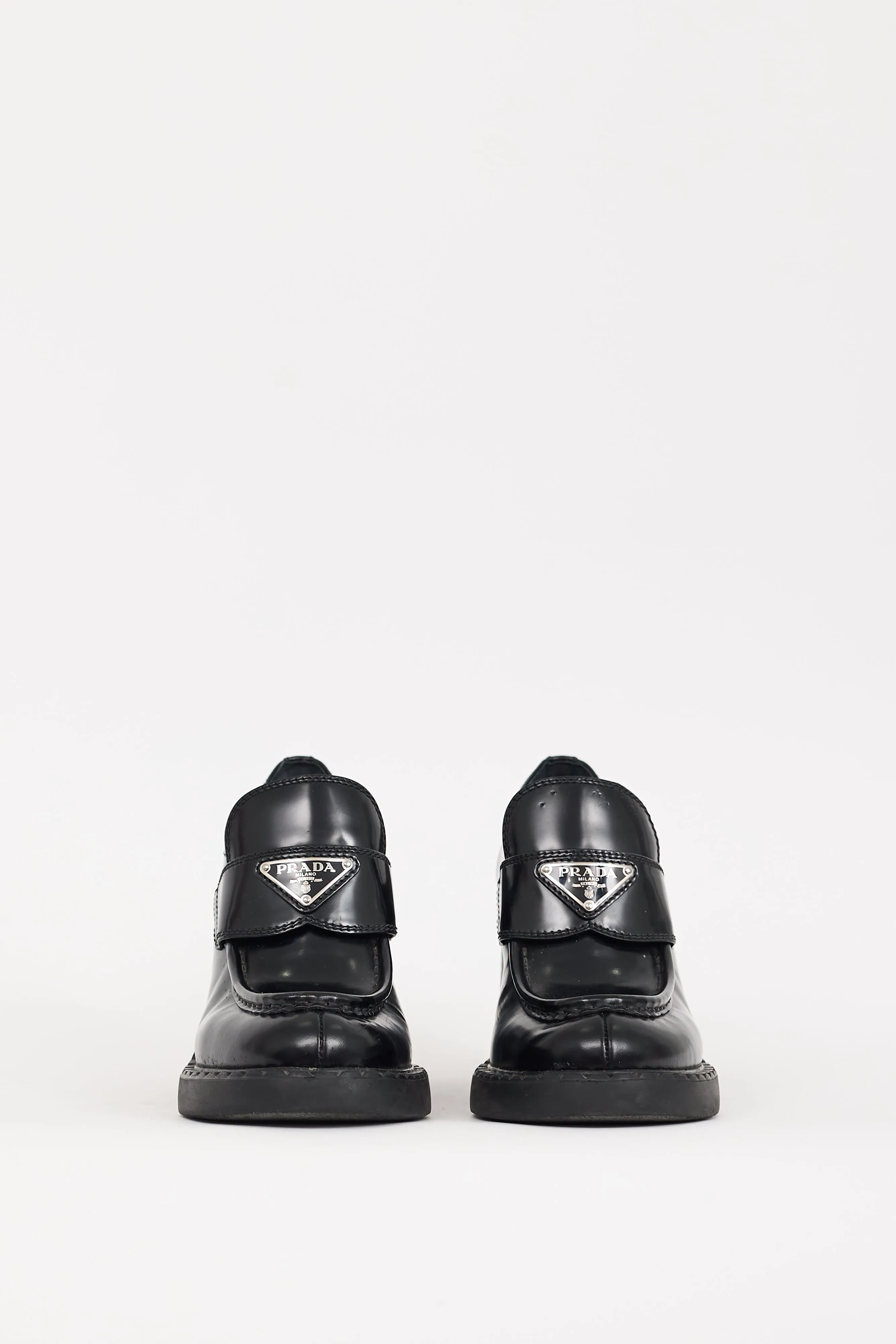 Black Leather Triangle Logo Heeled Loafer